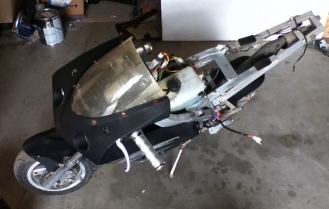 2006 Ford E350 - This scooter is in a state of disassembly, with its internal components and frame clearly visible.