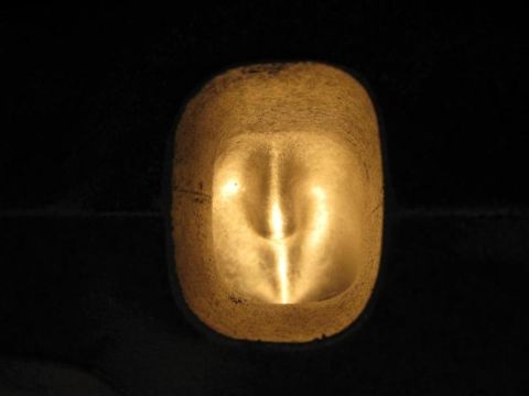 1972 Ford Ranchero - Close-up of a vehicle's headlight assembly, illuminated from within.