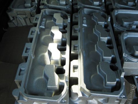1972 Ford Ranchero - Multiple cast iron intake manifolds are stacked and ready for installation.