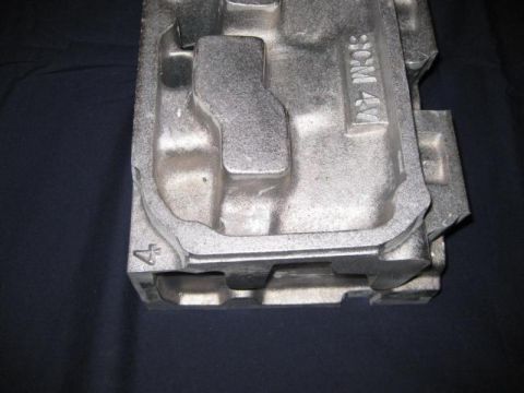 1972 Ford Ranchero - Close-up of a metal engine component showing casting marks 'SCM 4V' and '4'.