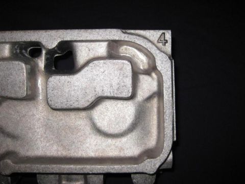 1972 Ford Ranchero - Metal casting with a visible number 4; likely a vehicle component.