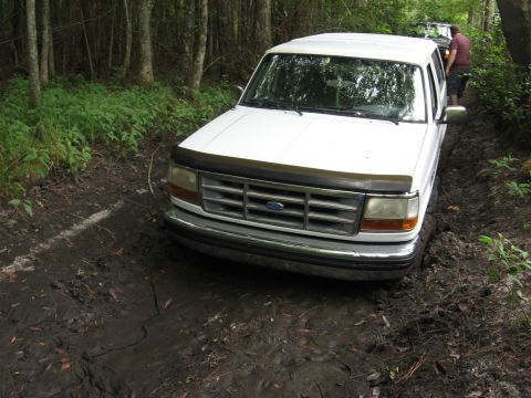 1994 Ford Bronco - This 1994 Ford Bronco is stuck deep in the mud on a wooded trail.