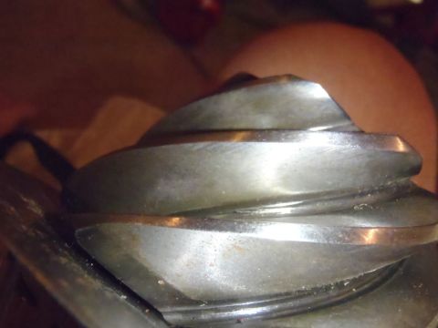 1990 Ford Bronco - A close-up view of a differential gear, showing its intricate teeth and signs of use.
