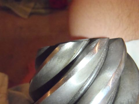 1990 Ford Bronco - Close-up view of worn gear teeth, likely from a vehicle drivetrain component.