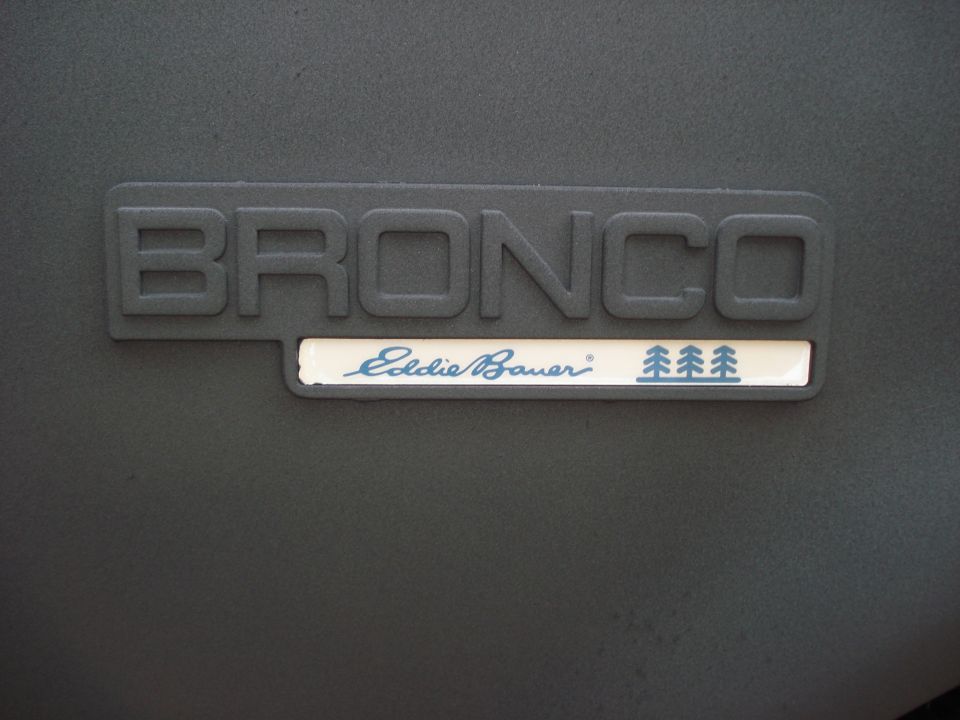 Bronco Eddie Bauer emblem on dark textured surface