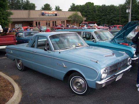 1971 Ford Ranchero - A light blue 1963 Ford Falcon Ranchero is parked at an outdoor event with other vehicles.