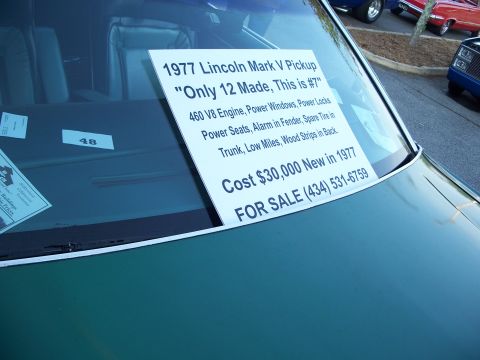 1971 Ford Ranchero - Sign on windshield details a 1977 Lincoln Mark V Pickup for sale, including its features and price.
