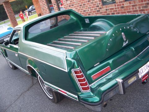 1971 Ford Ranchero - This Lincoln pickup truck has a distinctive two-tone green paint scheme and a wooden bed liner.