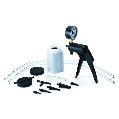 vacuum pump with gauge, collection bottle, tubing, and various adapters