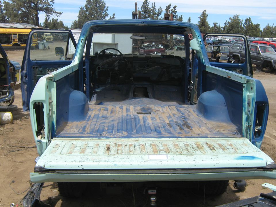 1978 Ford Bronco body with doors open, showing interior and bed