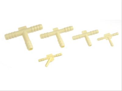 1990 Ford Bronco - A collection of beige plastic T-shaped connectors, varying in size, are displayed against a white background.