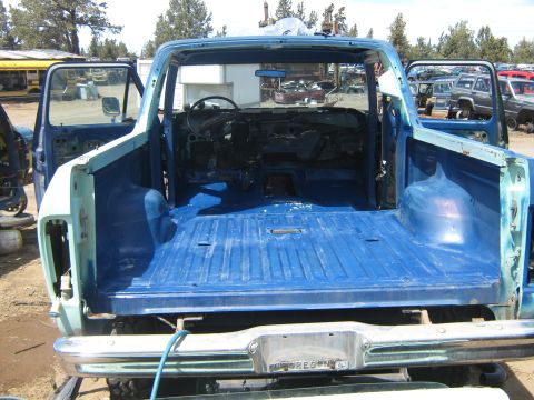 1978 Ford Bronco - This 1978 Ford Bronco is missing its engine and interior components, sitting in a salvage yard.