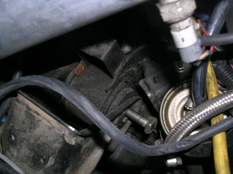 1995 Ford Probe - Engine bay component with electrical connectors and hoses, SuperMotors.net logo in corner.