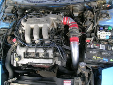 1995 Ford Probe - Engine bay of a 1995 Ford Probe, showing the V6 DOHC engine and modified intake.