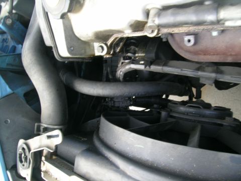 1995 Ford Probe - This image shows various engine bay parts including hoses and a fan, with a watermark from Supermotors.net.