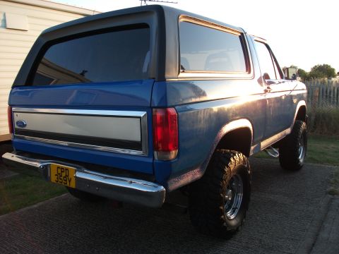 1982 Ford Bronco - This blue Ford Bronco features a lifted suspension and chrome accents.