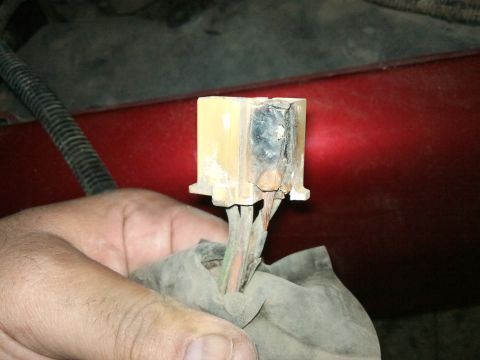 1998 Ford Crown Victoria - Close-up of a damaged electrical connector, likely from a vehicle's blower motor resistor.