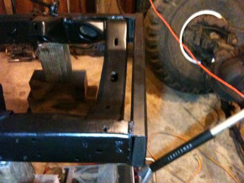 1976 Ford F-100 - Close-up of a vehicle frame and tire, with a Craftsman tool in the foreground.