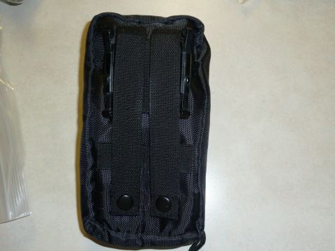 1992 Ford Mustang - This is a black tactical pouch with clips and snaps on the back.