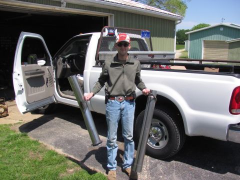 2008 Ford F-250 - Man with new exhaust pipes for his 2008 Ford F-250 pickup truck.