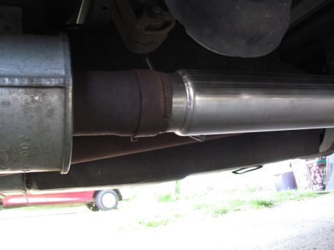 2008 Ford F-250 - Underside view of a vehicle's exhaust system, showing a muffler and pipe section.