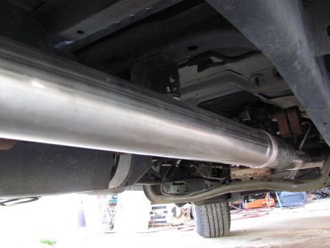2008 Ford F-250 - The underside of a truck shows a large, shiny exhaust pipe running along the frame. The registry claims it is a 2008 Ford F-250.