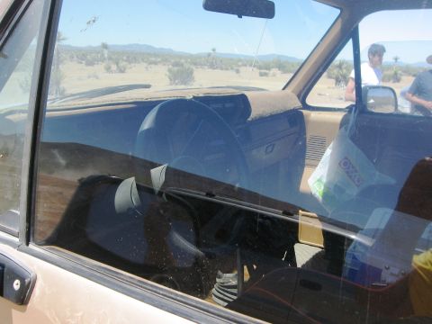 1986 Ford Bronco - Interior view of a 1986 Ford Bronco parked in a desert environment.