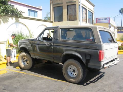 1986 Ford Bronco - This lifted Ford Bronco has aftermarket wheels and tires, and appears to be a 1987 model.