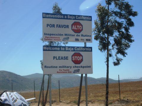 1986 Ford Bronco - Signage indicates a routine military checkpoint at the Baja California border, with instructions in both Spanish and English.