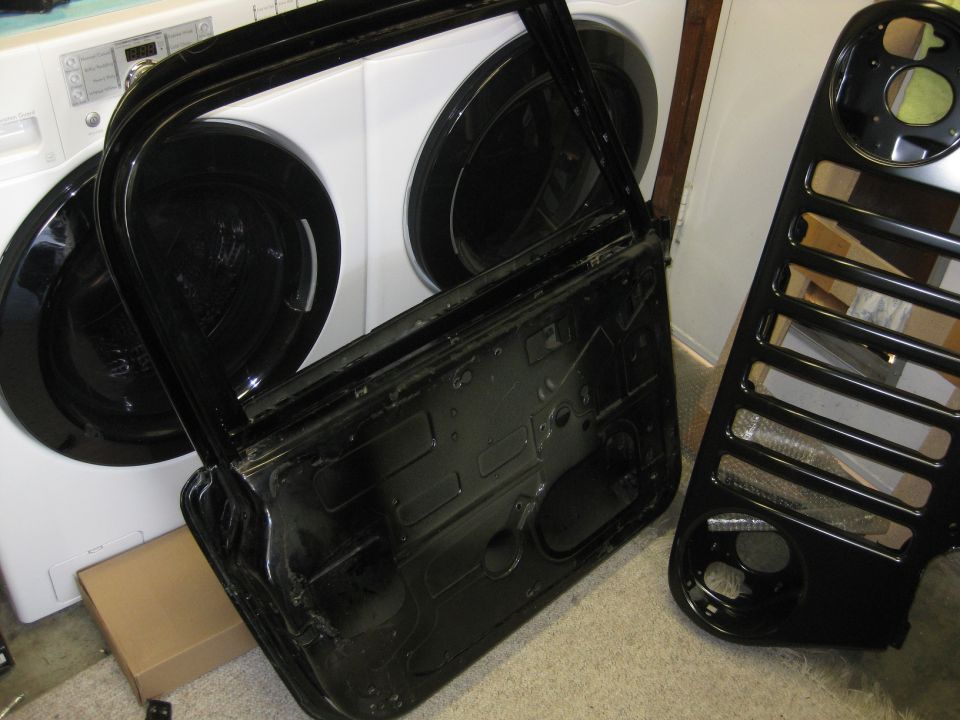 Black car door and grille with Supermotors logo