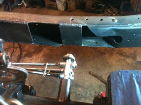1976 Ford F-100 - Welded frame section and suspension parts in a workshop setting.