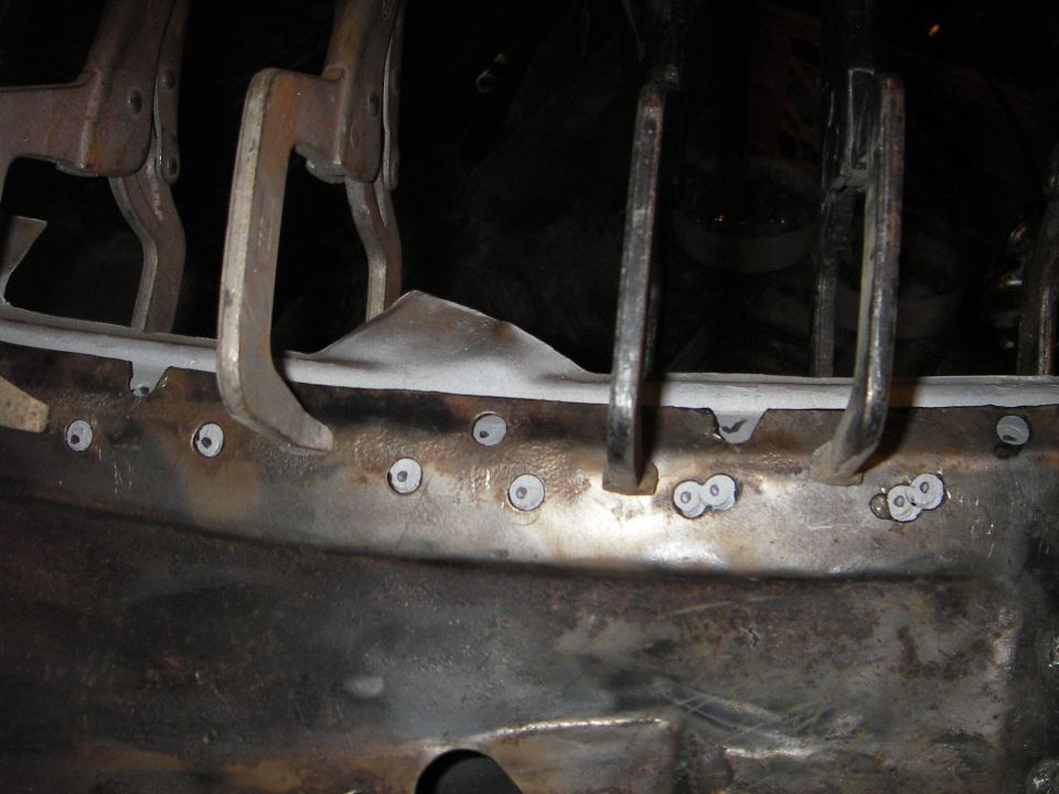 top edge of cowl cover clamped in place