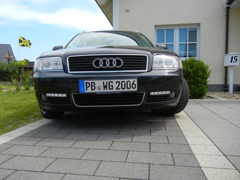 2003 Audi A6 - Front view of a black Audi A6, identified by its license plate as a 2006 model.