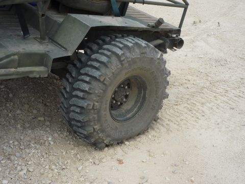 1990 Ford Bronco - Close-up of a heavy-duty tire and fender on an off-road vehicle.