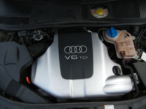 2003 Audi A6 - Close-up view of the engine bay, highlighting the Audi V6 TDI engine cover and coolant reservoir.
