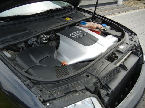 2003 Audi A6 - The engine bay of a car, showing the Audi V6 TDI engine cover.