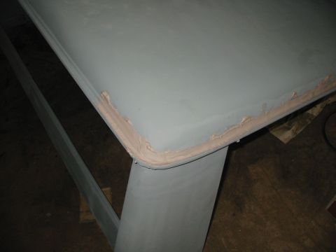 1969 Ford Bronco - putty knife was not working in the channel, but if you use your finger to wipe the bondo in... looks perfect