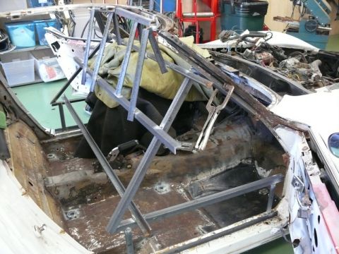 1976 Chevrolet Corvette - The interior of a 1976 Chevrolet Corvette is shown with metal bracing installed as part of a restoration project.