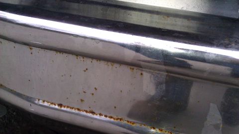 1984 Ford Bronco - This chrome bumper shows signs of rust, indicating wear and tear.