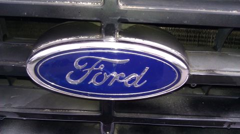 1984 Ford Bronco - Close-up of the Ford emblem on the grille of a 1984 Ford Bronco.