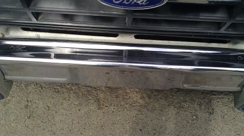 1984 Ford Bronco - Front view of a 1984 Ford Bronco, showing the grille and bumper details.