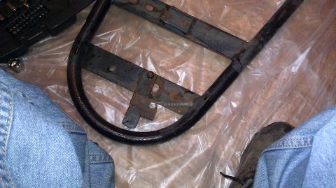 1984 Ford Bronco - Close-up of a spare tire rack, likely from an older vehicle.