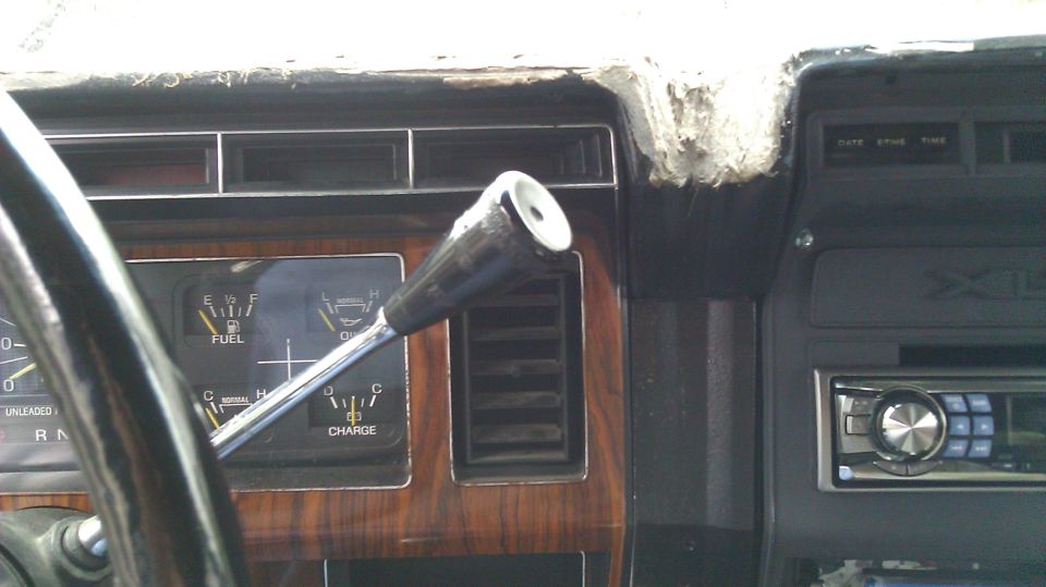 1984 Ford Bronco interior showing dashboard, fuel gauge, charge gauge, and gear shifter