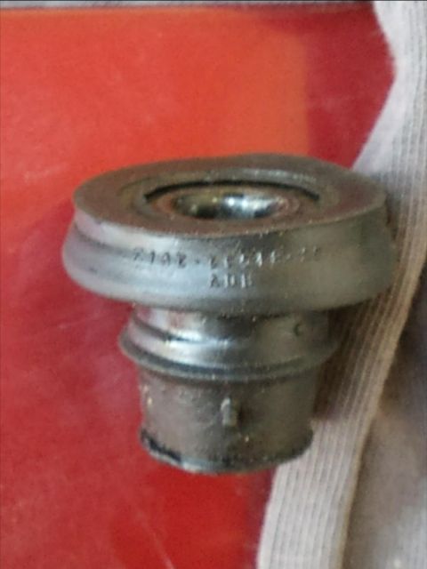 1998 Ford Crown Victoria - A close-up view of a valve cover grommet, showing some stamped part numbers.