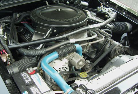 2007 Ford Mustang - The engine bay features a 5.8 Liter V8 H.O. air cleaner and a prominent Ford logo.
