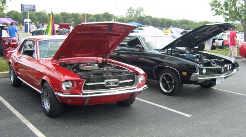 2007 Ford Mustang - A red 1967 Ford Mustang is displayed with its hood open at an outdoor car show.