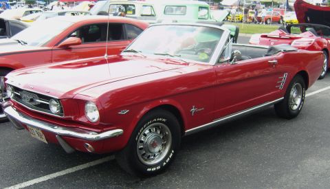 2007 Ford Mustang - This red convertible features classic styling with chrome accents and side vents, distinct from the 2007 Ford Mustang.