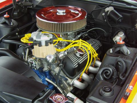 2007 Ford Mustang - Close-up view of a modified engine bay, highlighting custom components and performance parts.