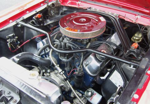 2007 Ford Mustang - Close-up of a Ford V8 engine, likely from a classic Mustang, showing the air intake and engine block.