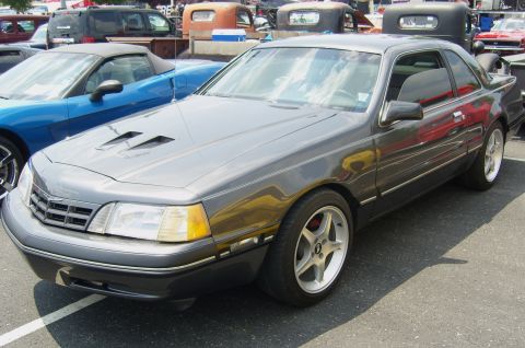 2007 Ford Mustang - 1987 Ford Thunderbird coupe with aftermarket wheels and hood scoops.